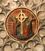 Image of a ceiling boss depicting the Cross of Gneth