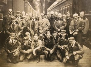 The gentlemen of St George's Chapel, Windsor and the choir boys of Westminster Abbey on a train platform in Canada, February 1927.