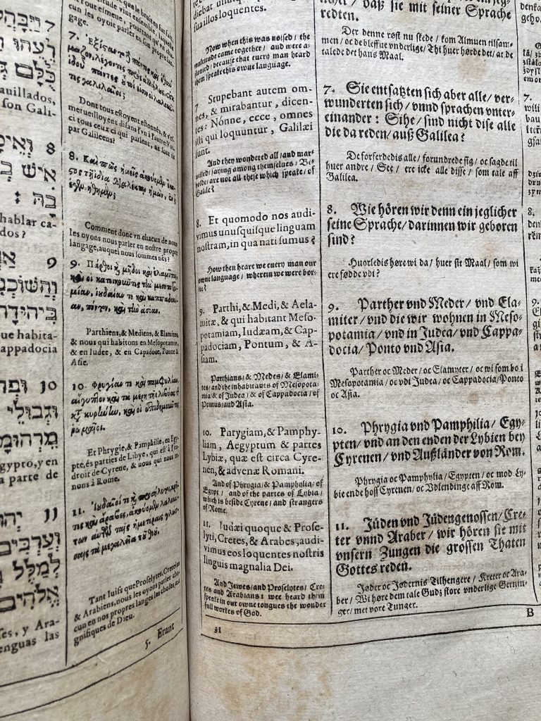 A page of printed text in several different languages, focusing on the English and Latin translations for chapter 2 of the New Testament book of Acts. Printed in black ink on off-white paper.